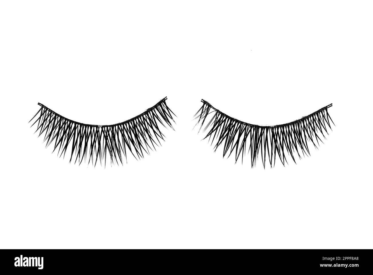 Fake eyelashes on white background, top view. Makeup product Stock