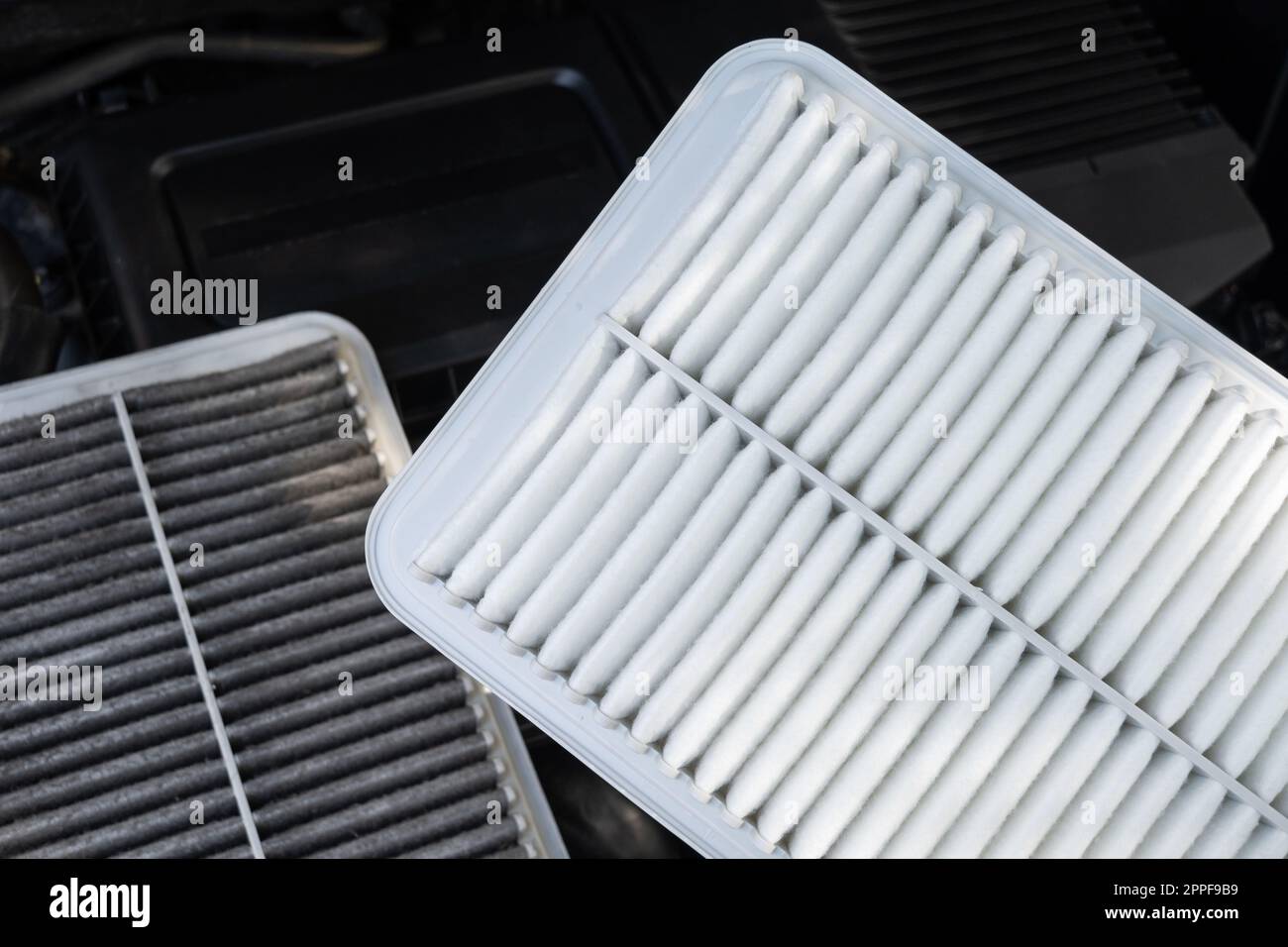 Changing car air filter, close up at the new and clean air filter. Car