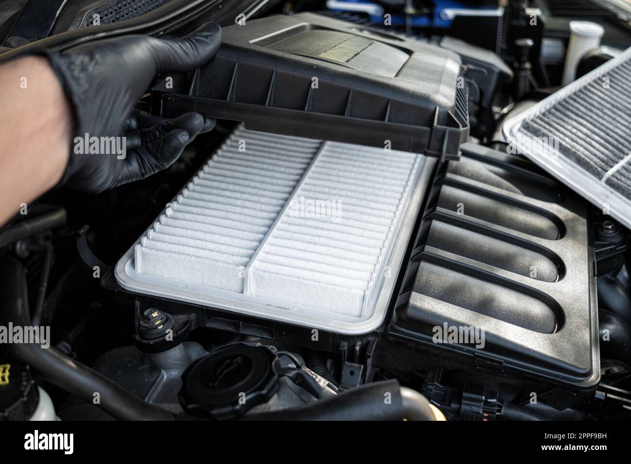 Changing car air filter, close up at the new and clean air filter. Car