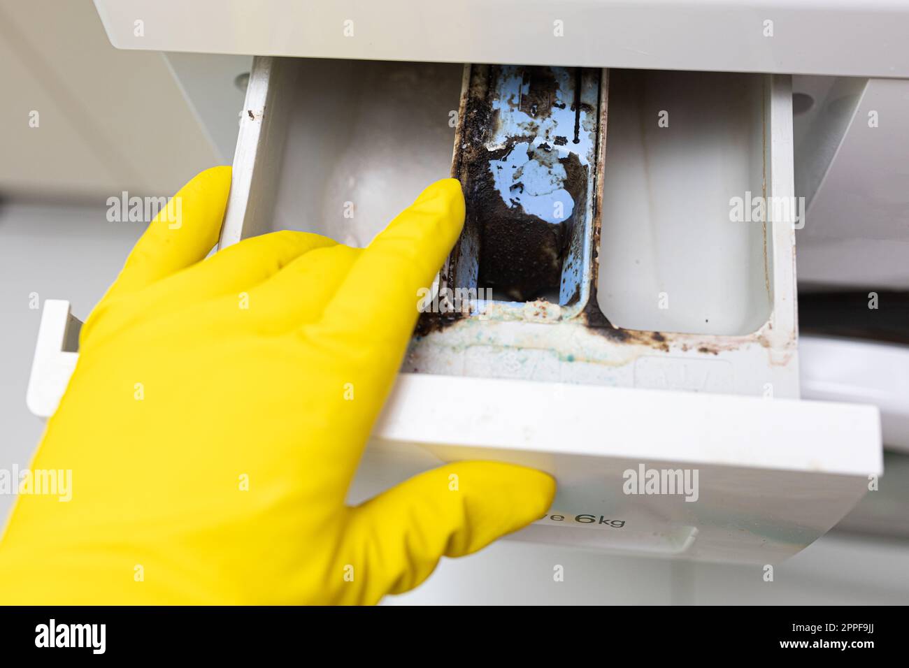 Corrosive, moldy lime scaled, dirty washing machine compartment tray