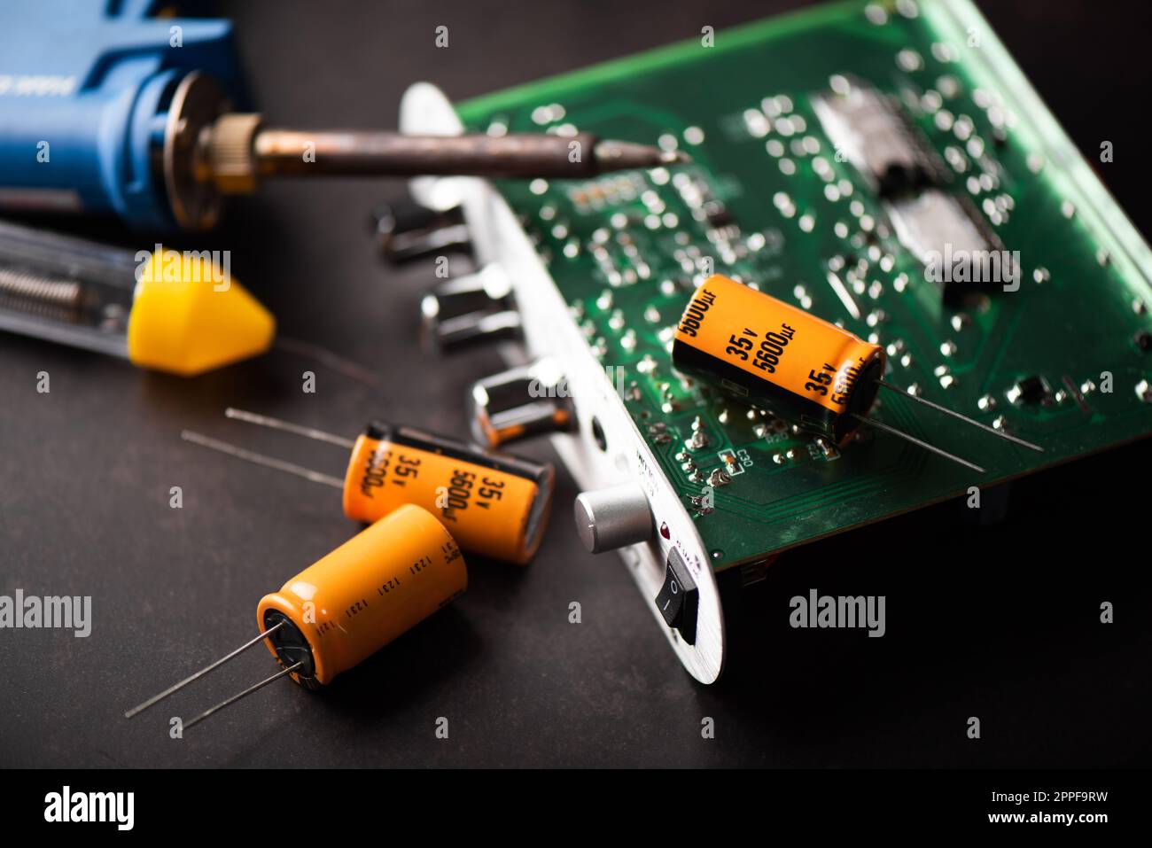 Technician repairing the electronic device. Reparing the audio