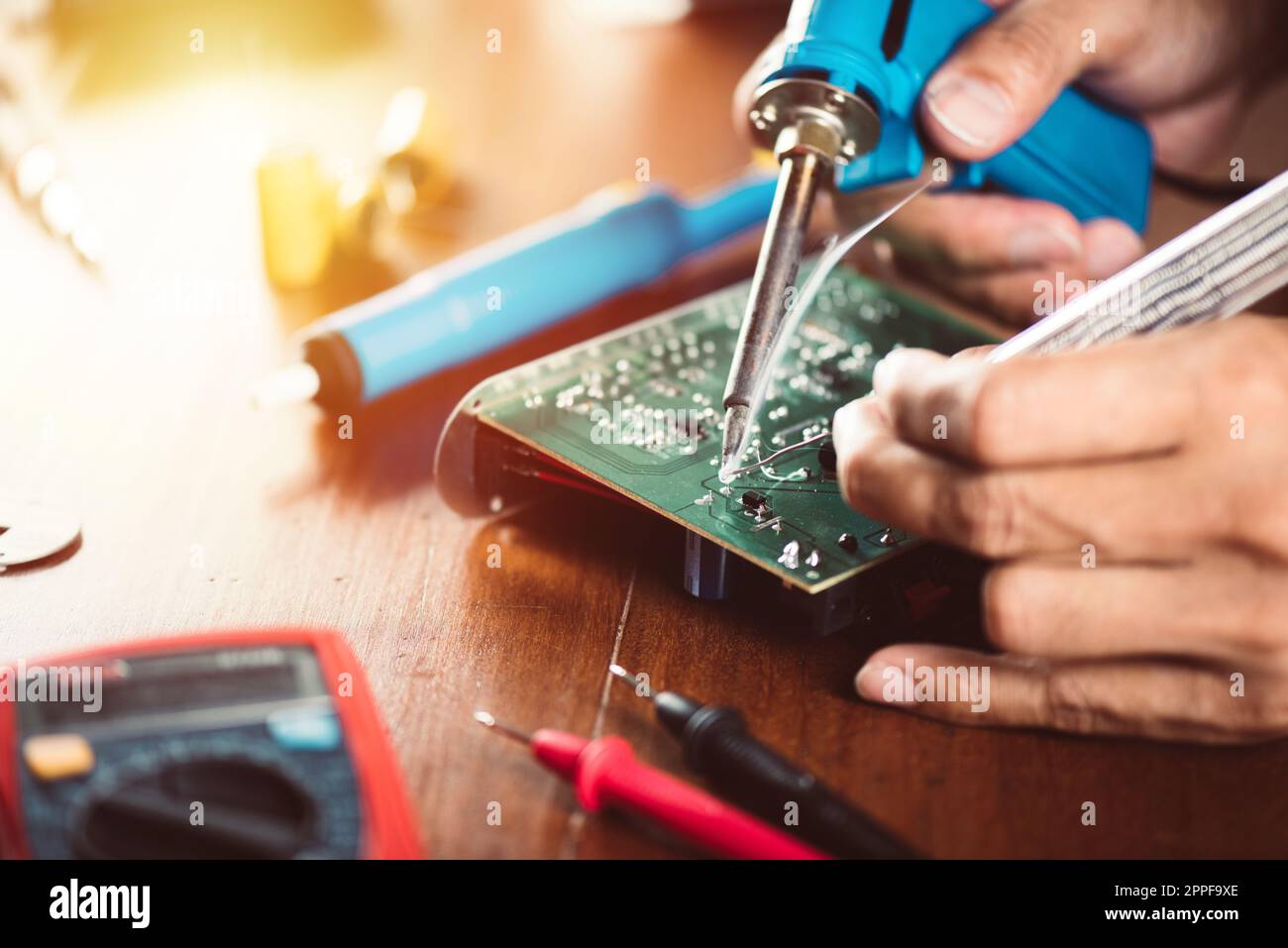 Technician repairing the electronic device. Reparing the audio