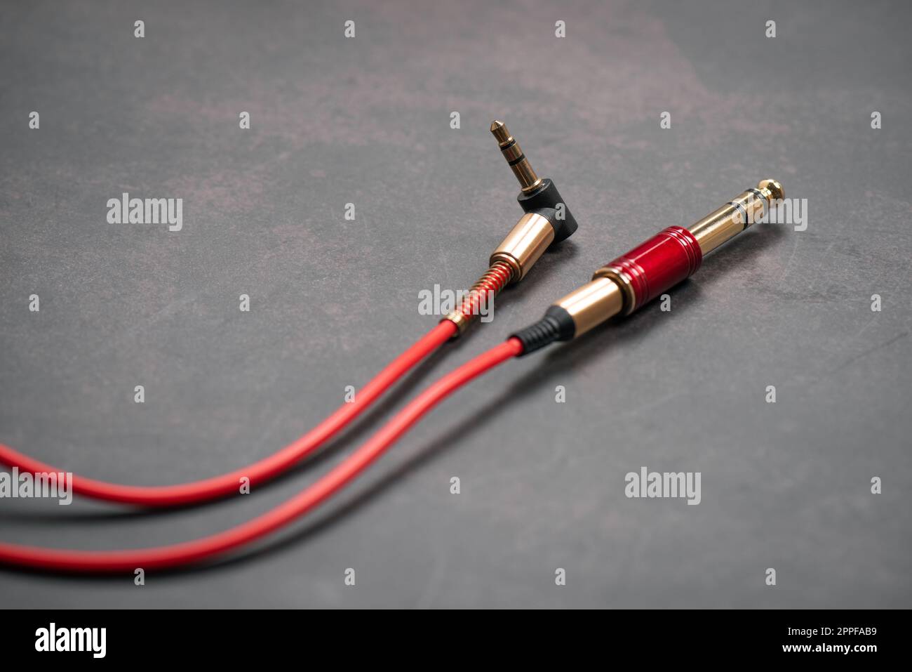 Red AUX(Auxiliary) cable with jack MaletoMale. Cable for stereo input