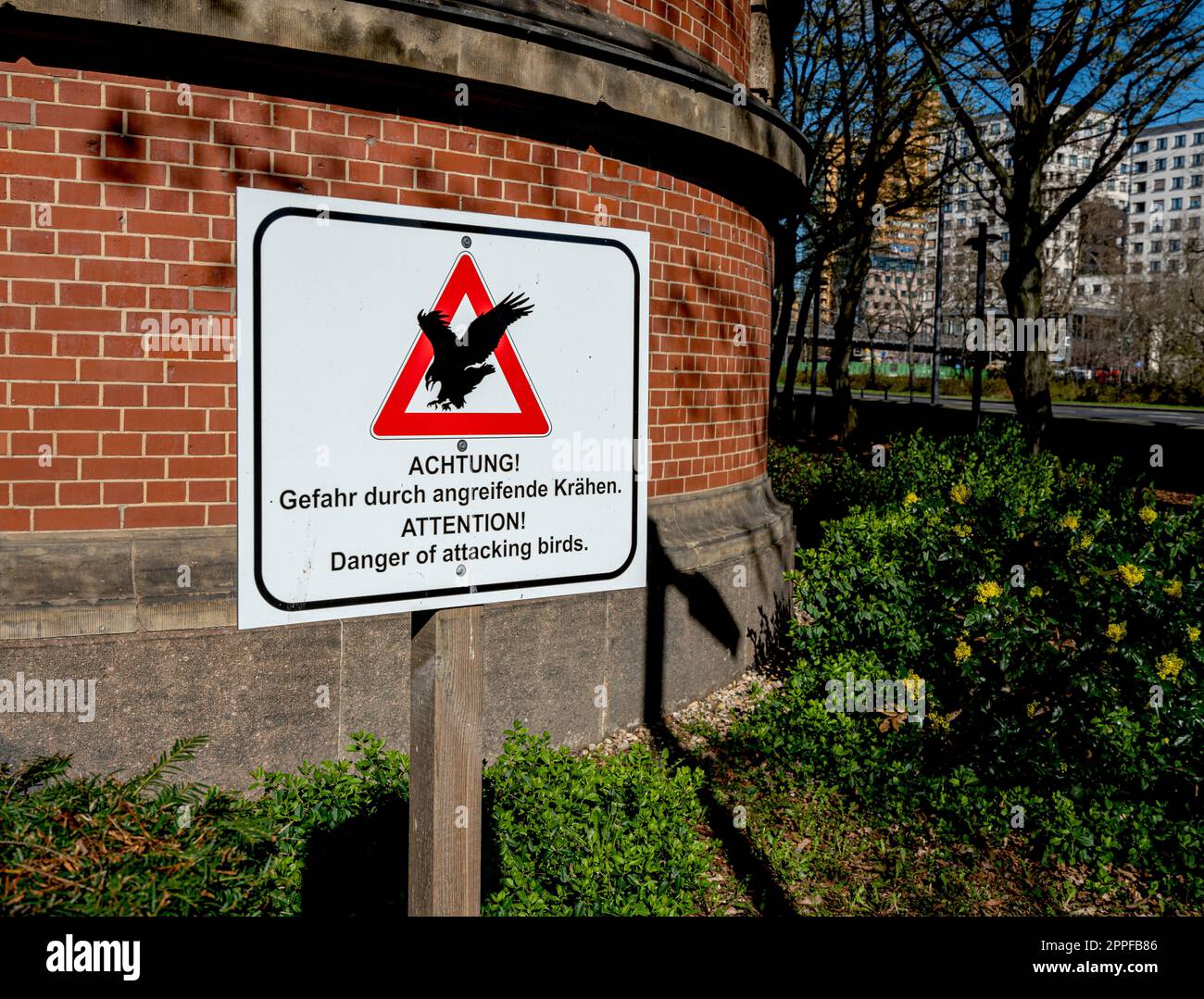 Sign In Front Of A Building, Danger From Attacking Crows, Berlin, Germany Stock Photo