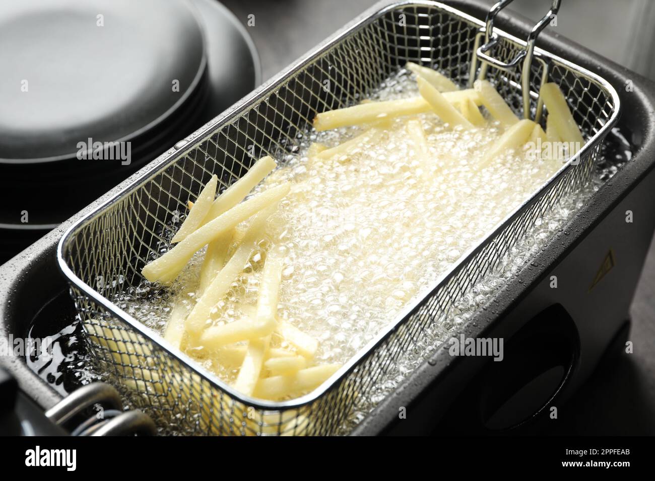 Cooking delicious french fries in hot oil Stock Photo - Alamy Best oil for fries