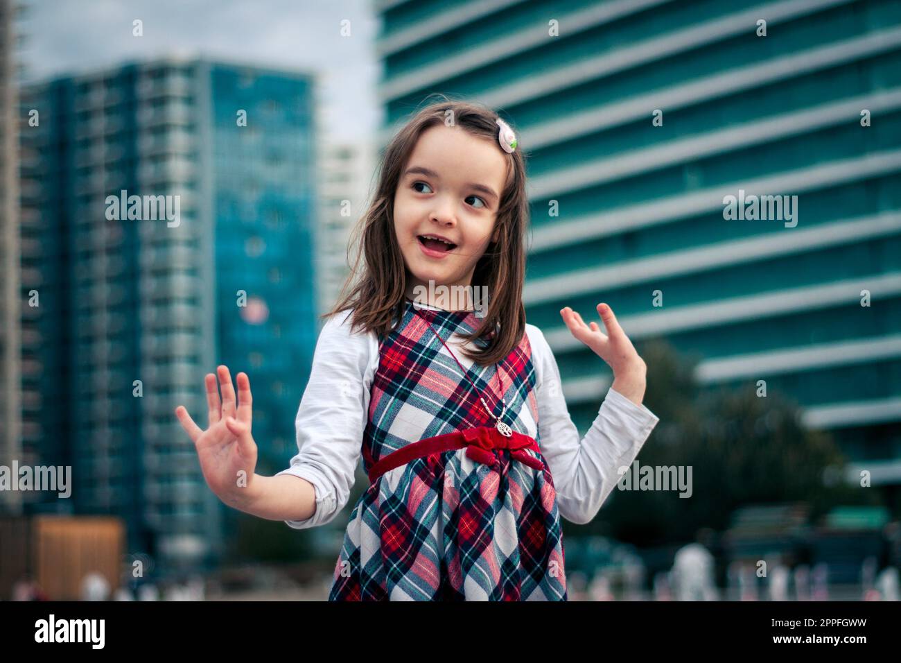 Little girl having fun outdoors Stock Photo