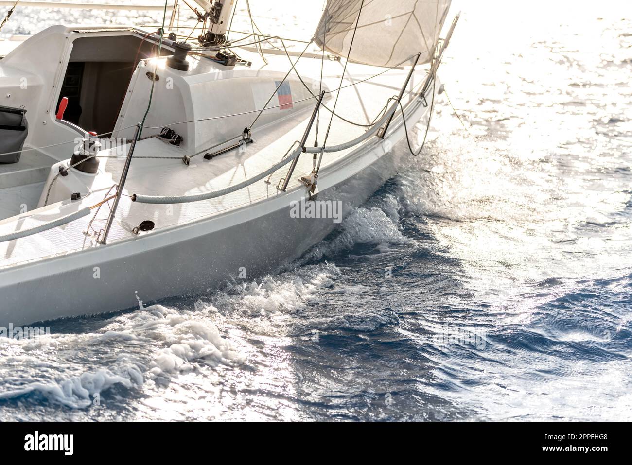 Sunset sailing on a sport yacht. Close-up shot Stock Photo