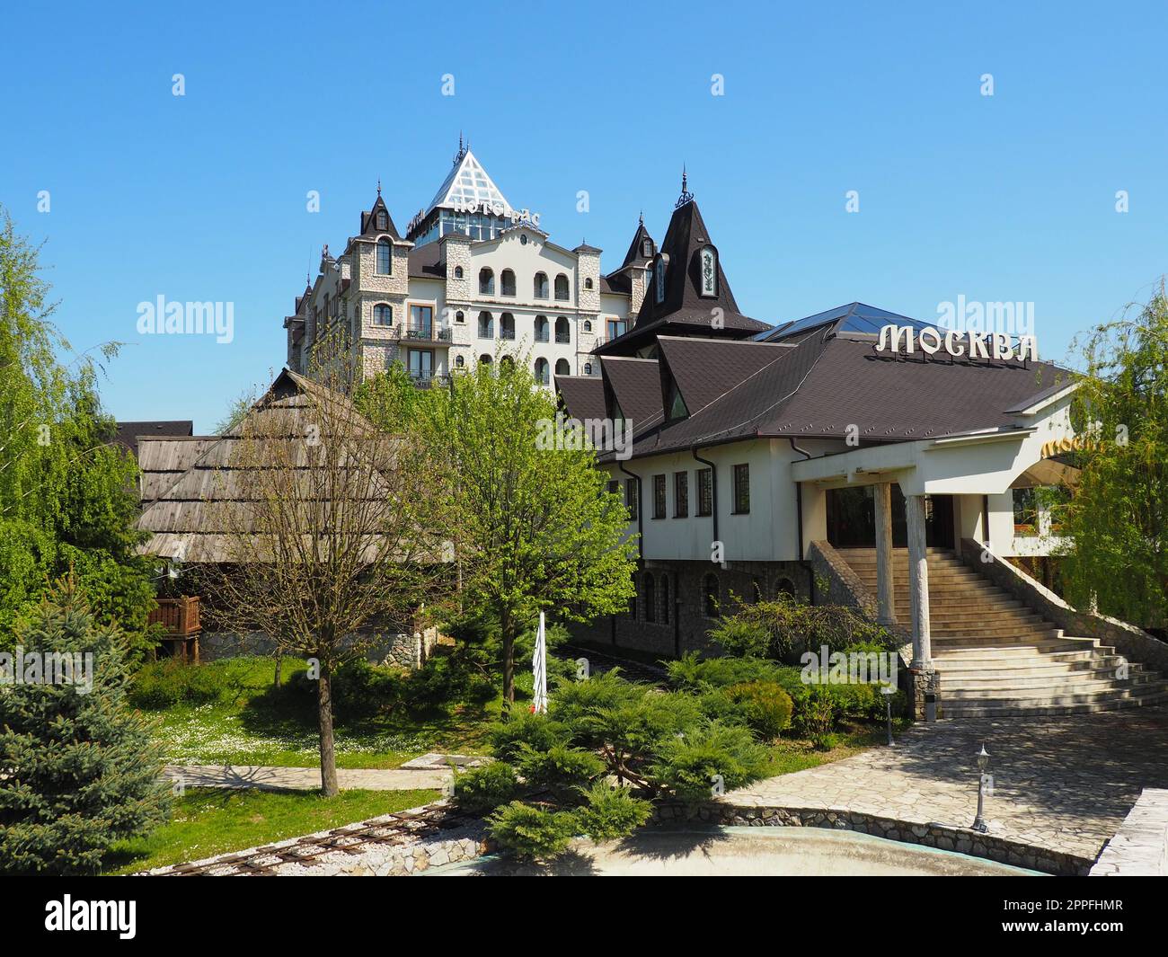 Stanisici, Bijelina, Bosnia and Herzegovina, April 25, 2021. Ras hotel and restaurant Moscow. Tourist facilities. The inscription -Moscow, and Race. Young green trees. Ethno village Stanishichi Stock Photo