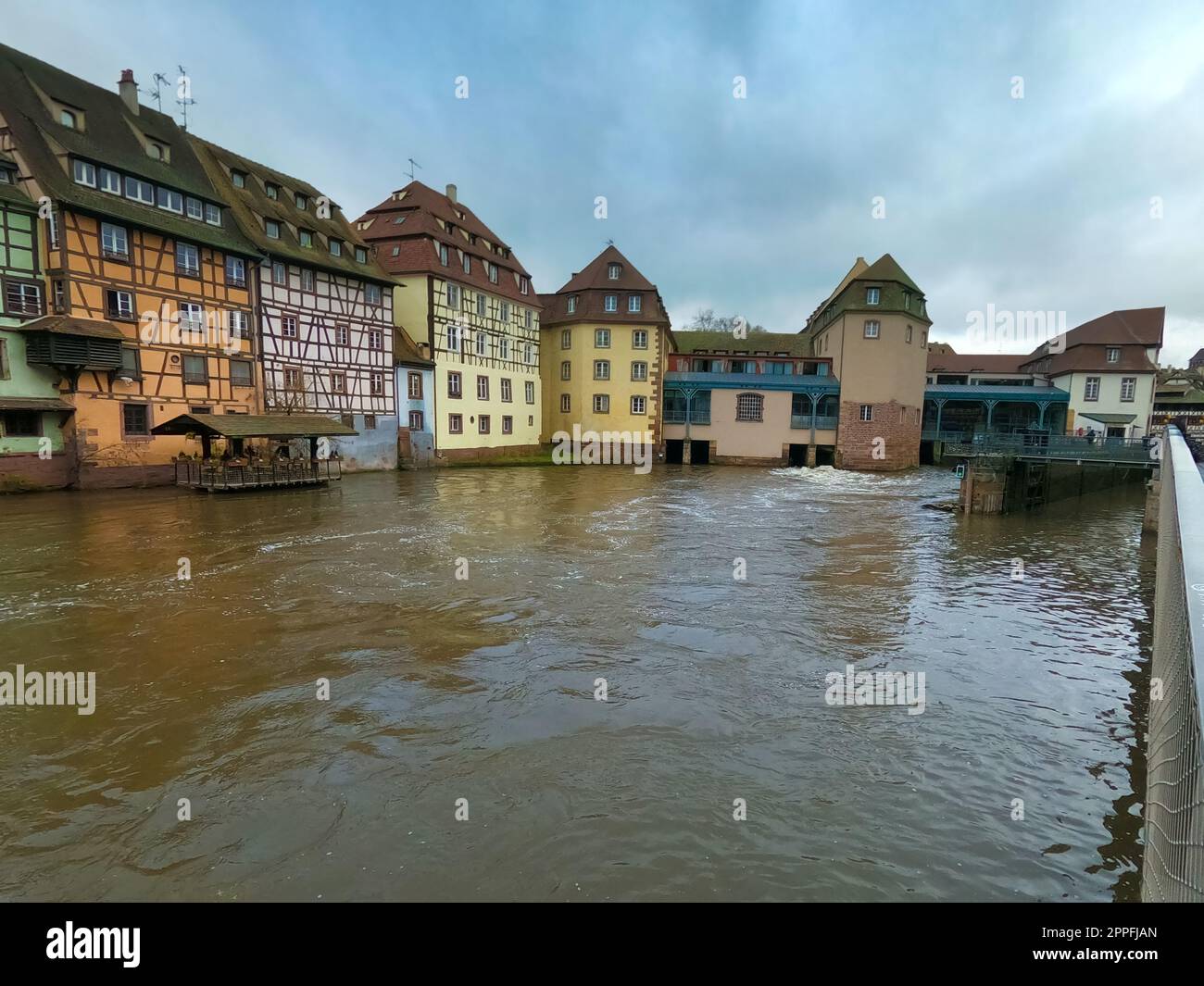 view of medieval buildings reflection on the channel at little france quarter in Strasbourg by winter Stock Photo