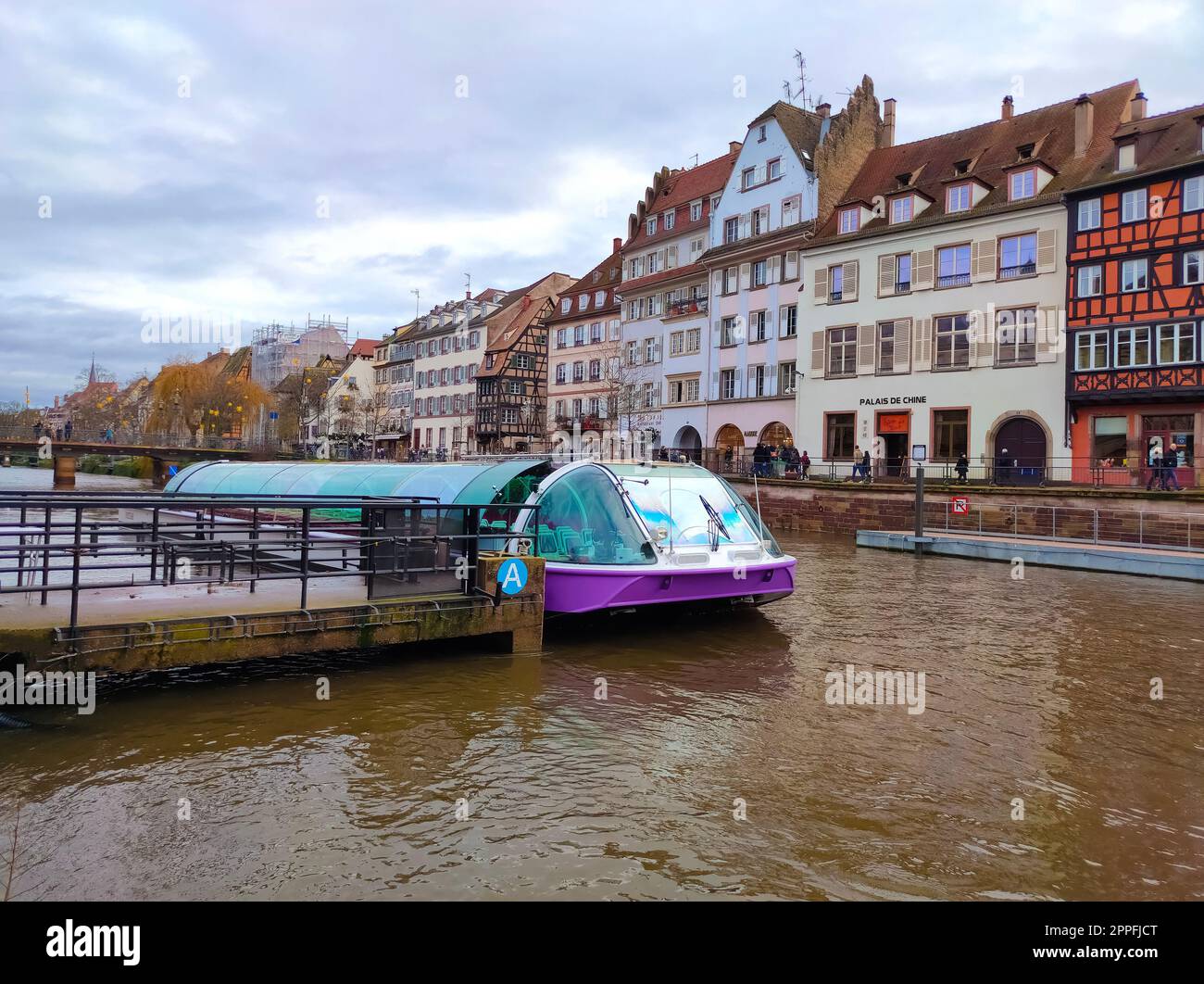River tram with tourists on a water canal on ancient houses background. River view. Strasbourg city, France. Famous tourist destination, travel, tourism Stock Photo
