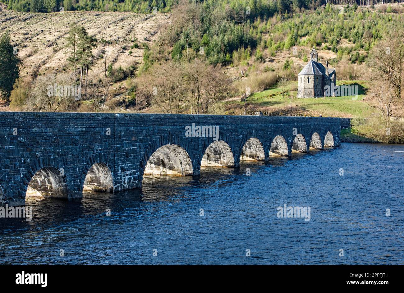 Garreg Ddu Dam and Sunlit Arches at Garreg Ddu Reservoir in the Elan Valley Powys in Mid Wales on a sunny Spring day. Stock Photo