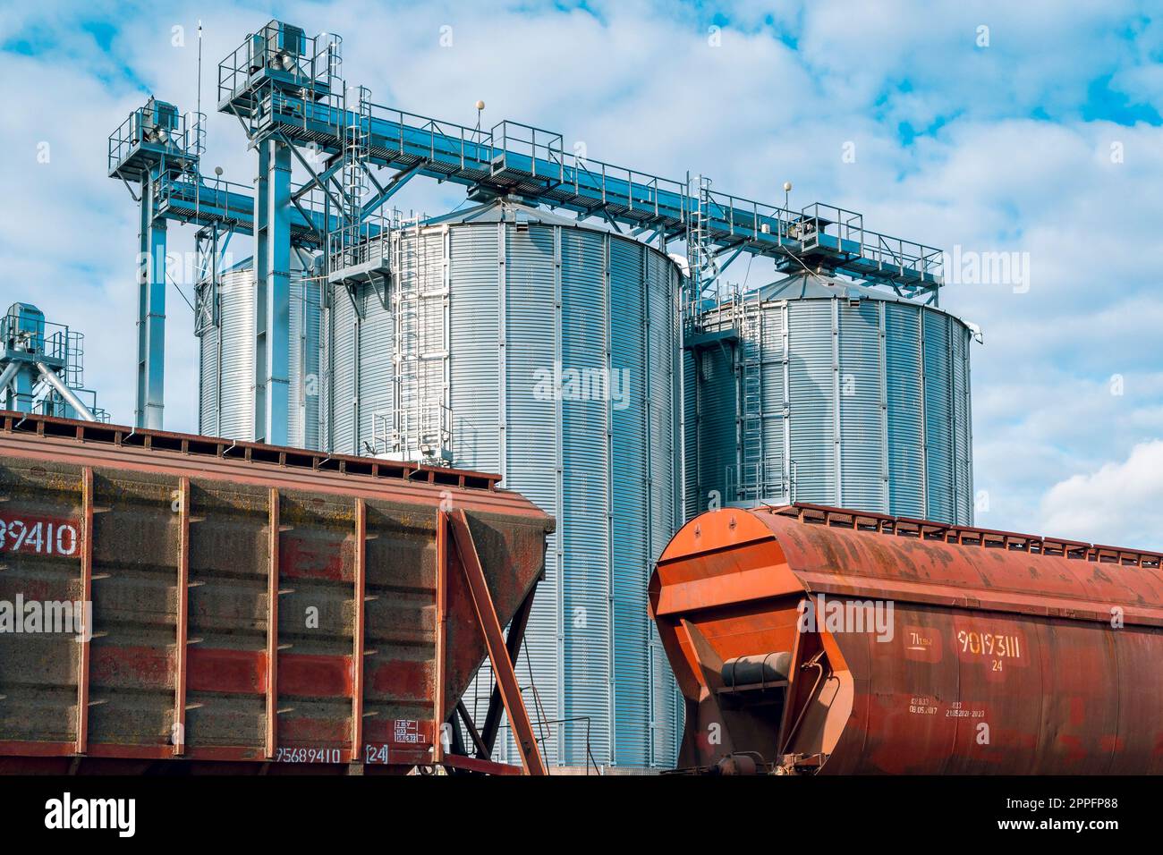 Closeup of railway carriages with grain at grain elevator. Grain silo
