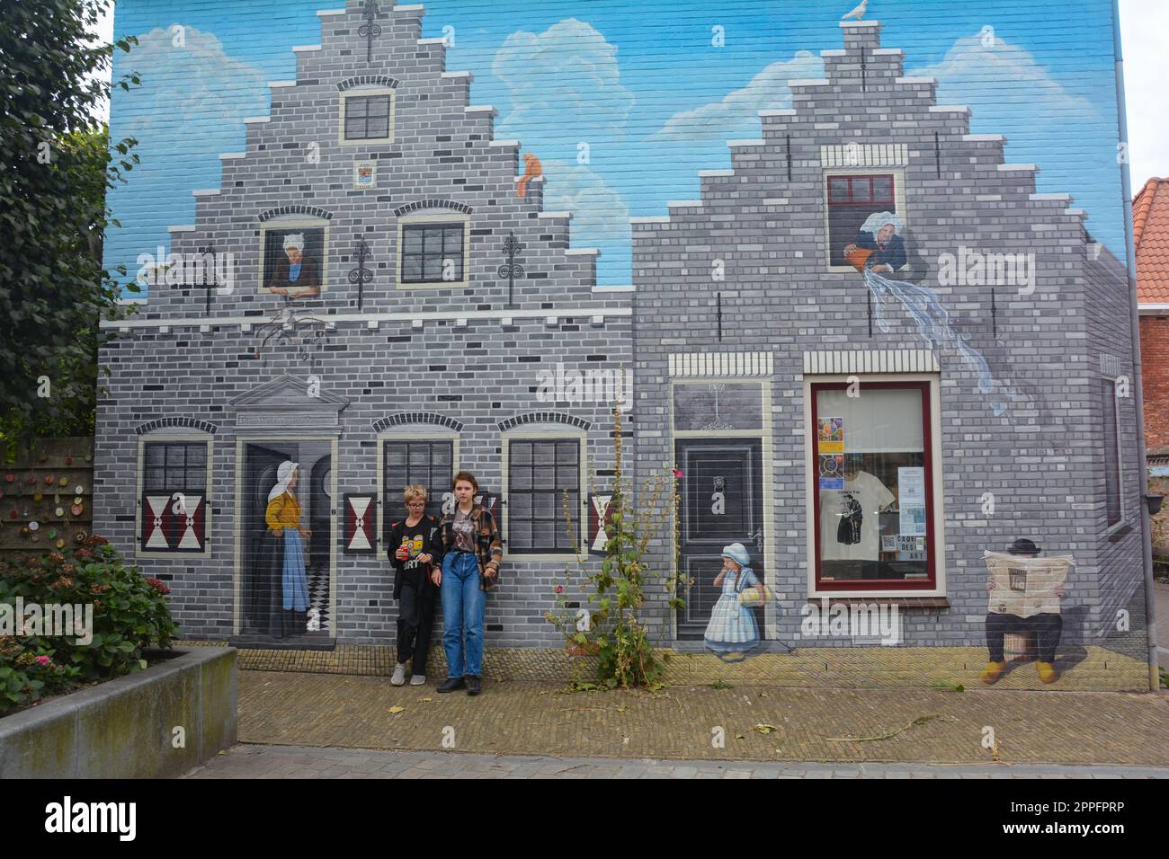 Zierikzee, Zeeland, The Netherlands , August 27th 2020 - Ornate mural on Plein Montmaertre with two children in front Stock Photo