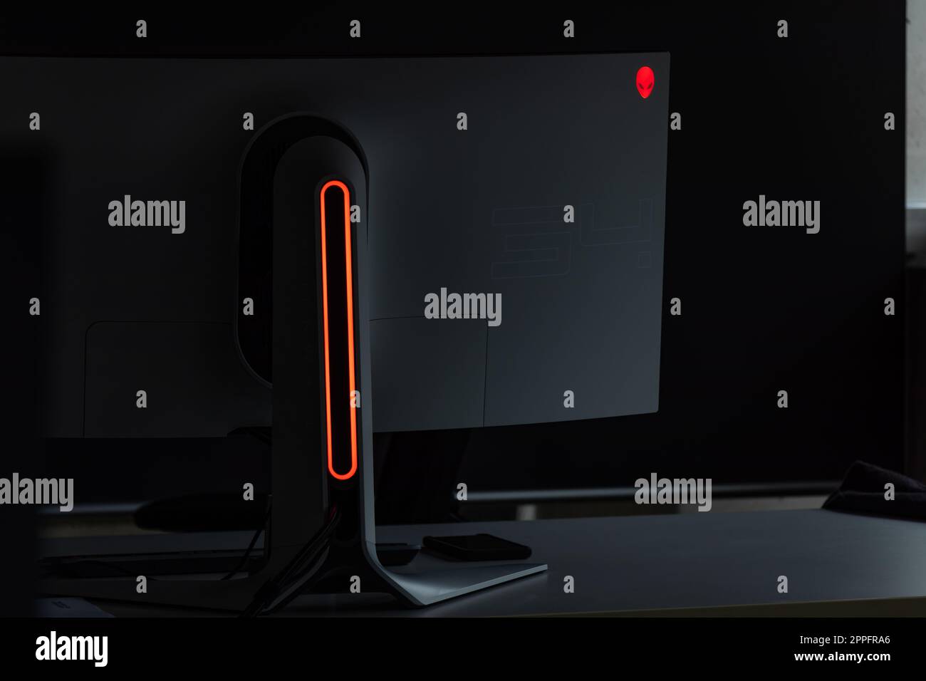 Alienware Gaming Monitor Computer Screen Computer Monitor Curved on Desk in Office Stock Photo