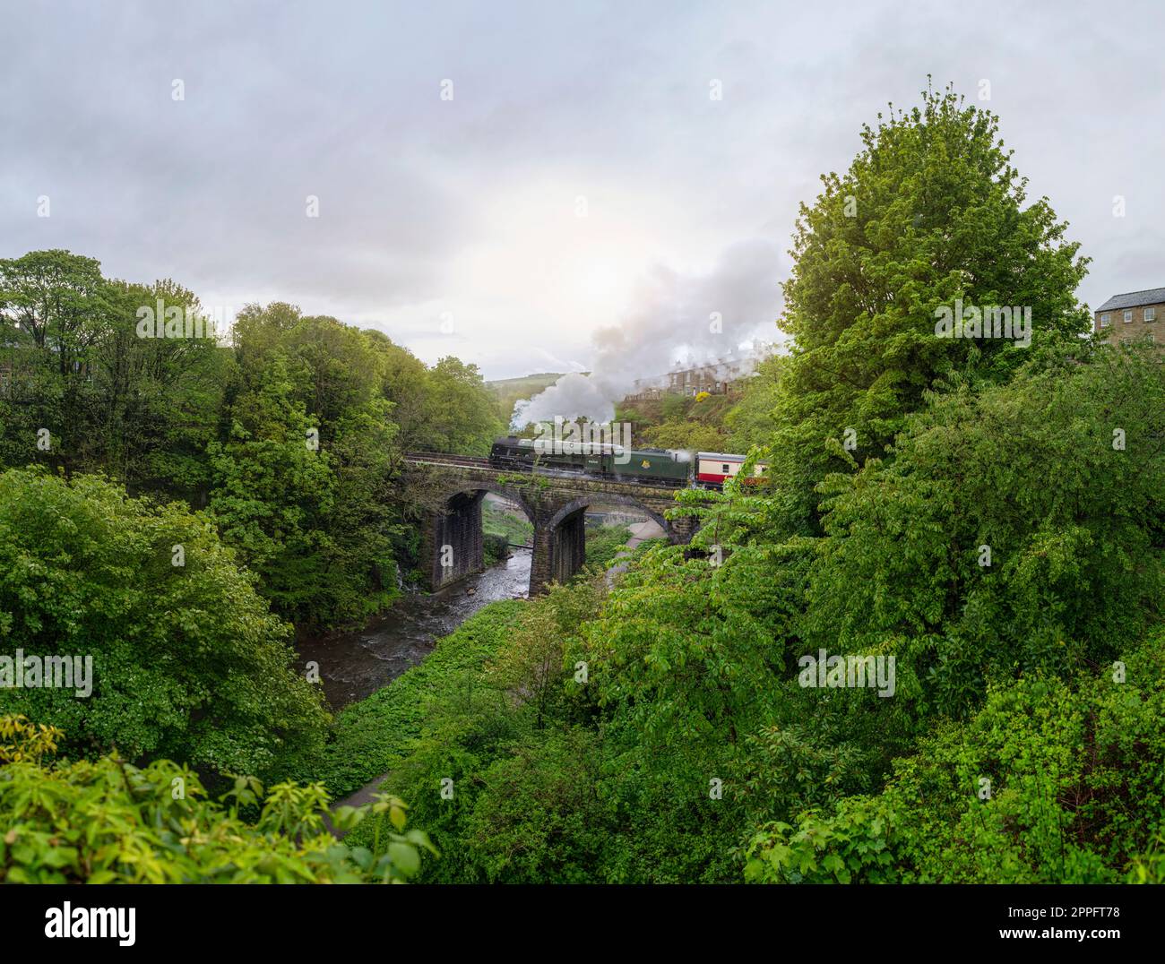 Royal Scott Steam Train going over a bridge in the Torrs of New Mills, Derbyshire. An old railway engine steaming through this Northern English town. Stock Photo