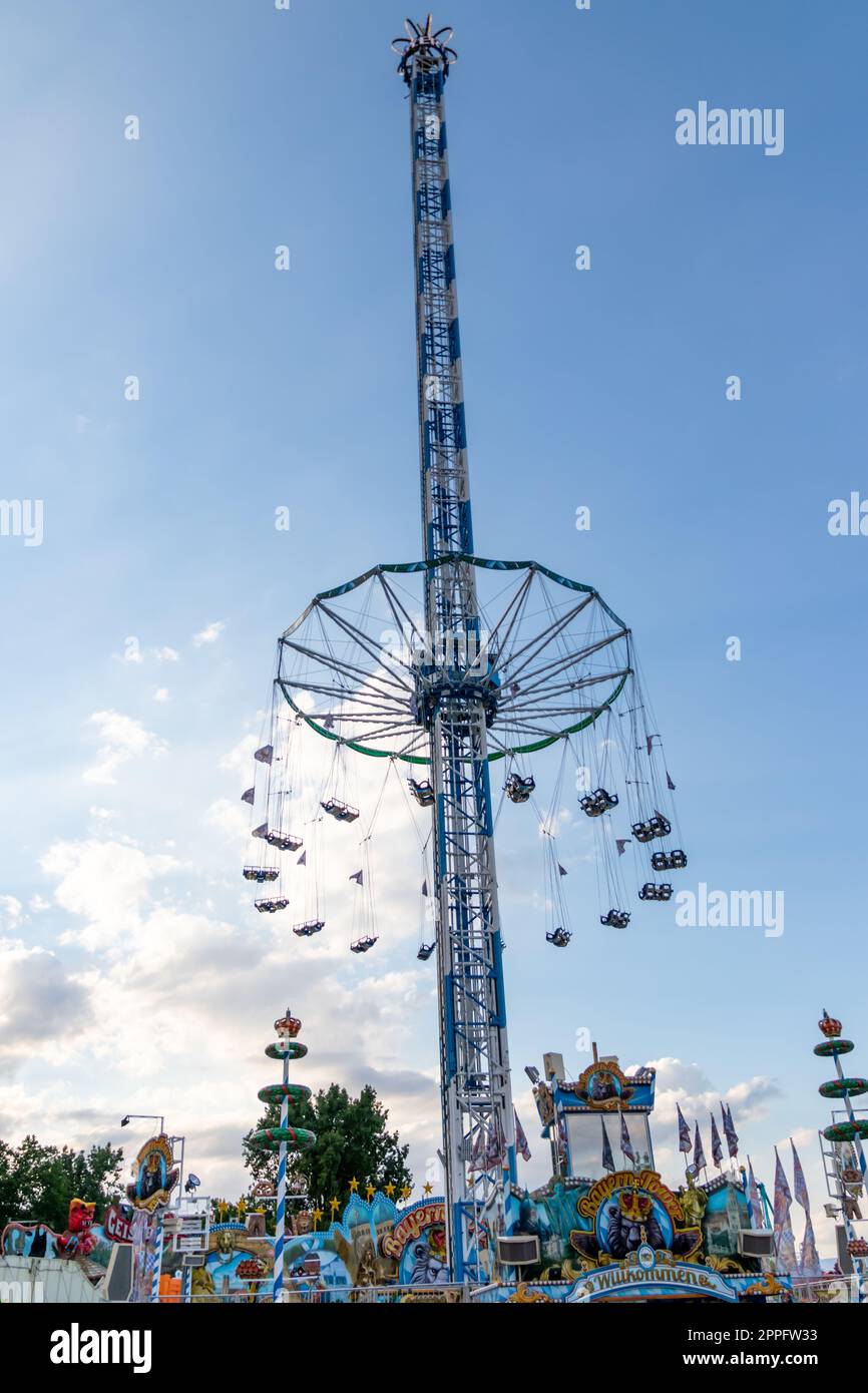 DÃ¼sseldorf, NRW, Germany - 07 14 2022: free fall tower Bayern Tower waiting for guests on the Dusseldorfer Rheinkirmes amusement park as big parish fair and kermis in Germany for fun adrenaline kick Stock Photo