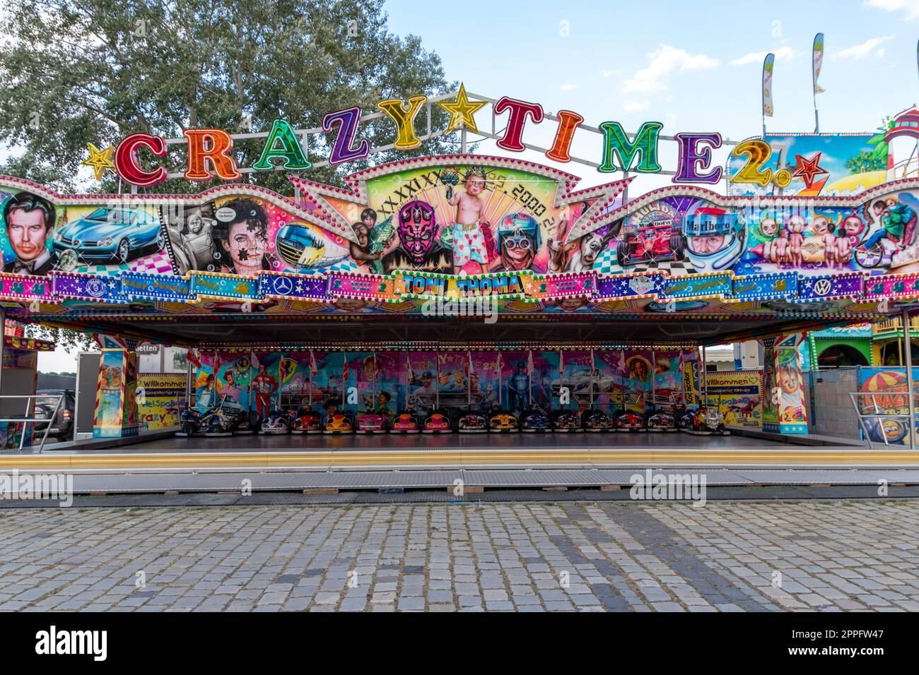 DÃ¼sseldorf, NRW, Germany - 07 14 2022: bumper cars and dodgem cars waiting for drivers on the Dusseldorfer Rheinkirmes amusement park as big parish fair and kermis in Germany for fun and action cars Stock Photo