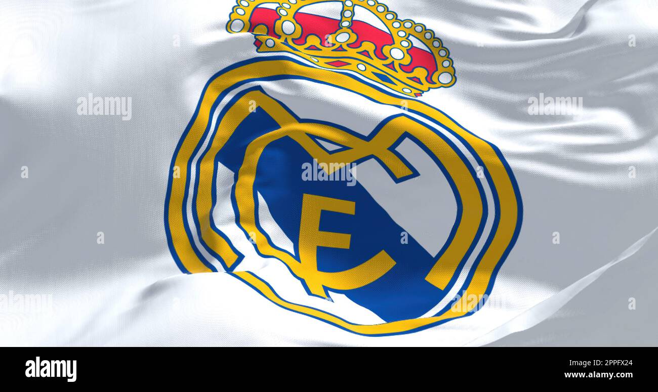 The flag of Real Madrid Club de Futbol waving in the wind on a clear day Stock Photo