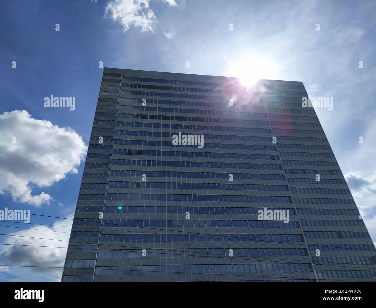 Dusseldorf, Germany - July 16th, 2022: High skyscraper Dreischeibenhaus from Thyssenkrupp in DÃ¼sseldorf as tall building in summer as contemporary architecture and clean glass facade blue sky clouds Stock Photo