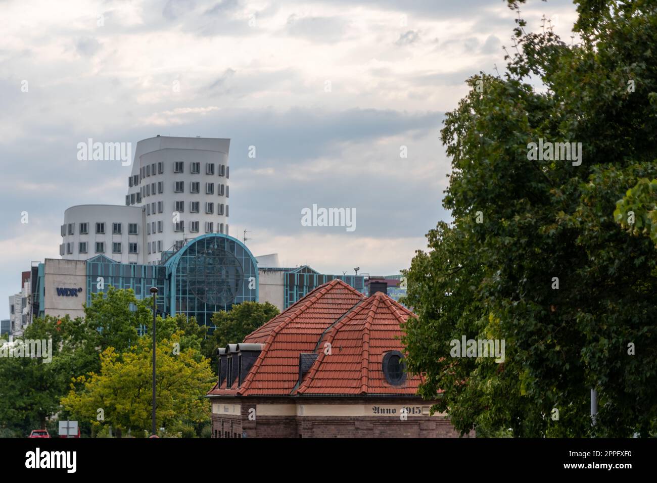 DÃ¼sseldorf, Germany 07 20 2022: WDR Westdeutscher Rundfunk central in Dusseldorf with WDR logo and Ghery buildings in background of Medienhafen Dusseldorf radio broadcasting and television production Stock Photo