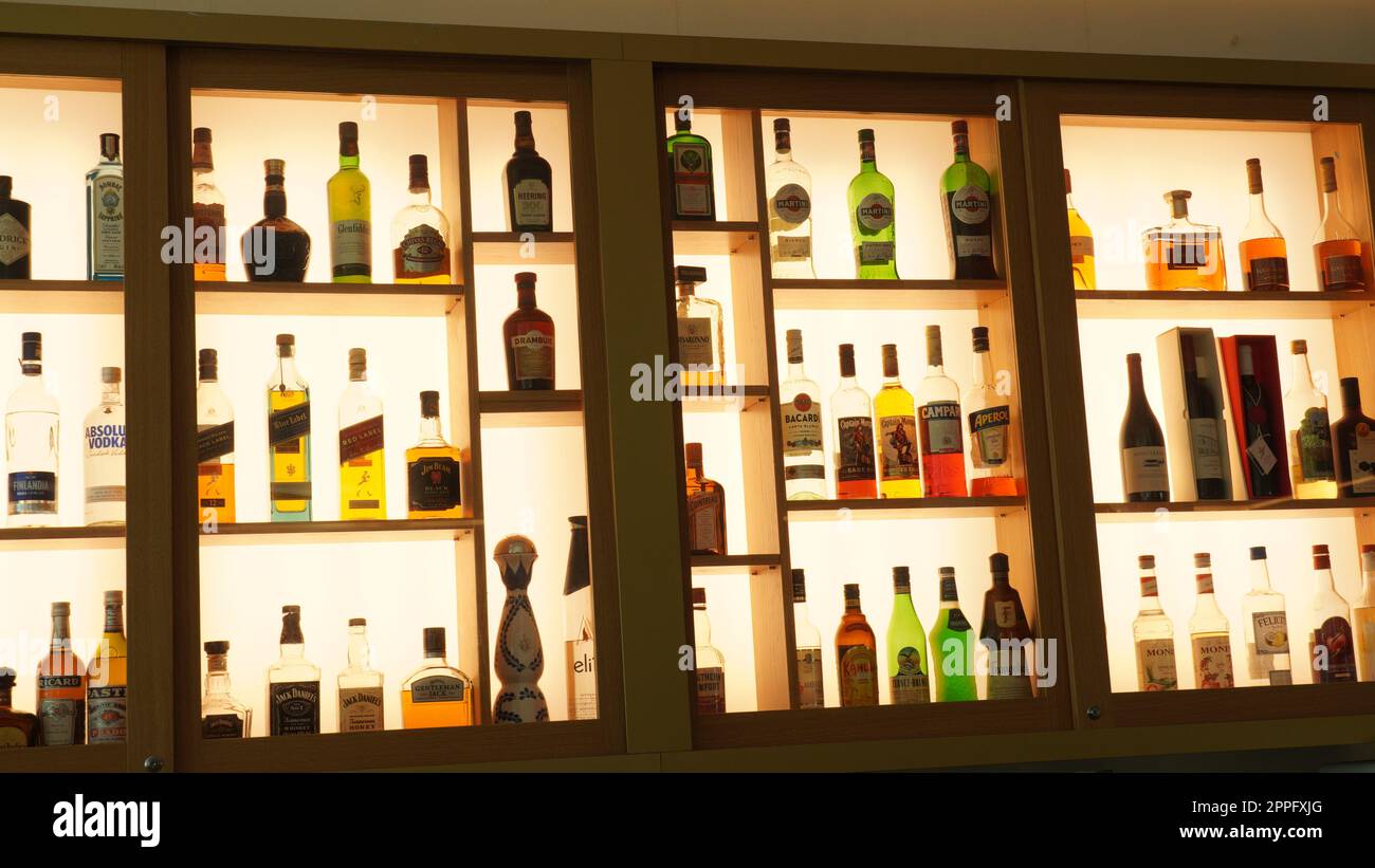 Ein-Bokek, Israel - JULY 6:Different brands of booze,  or alcohol in a bar or tavern. Multiple bottles of adult beverages. Wine, whisky, liquor in the shelf Stock Photo