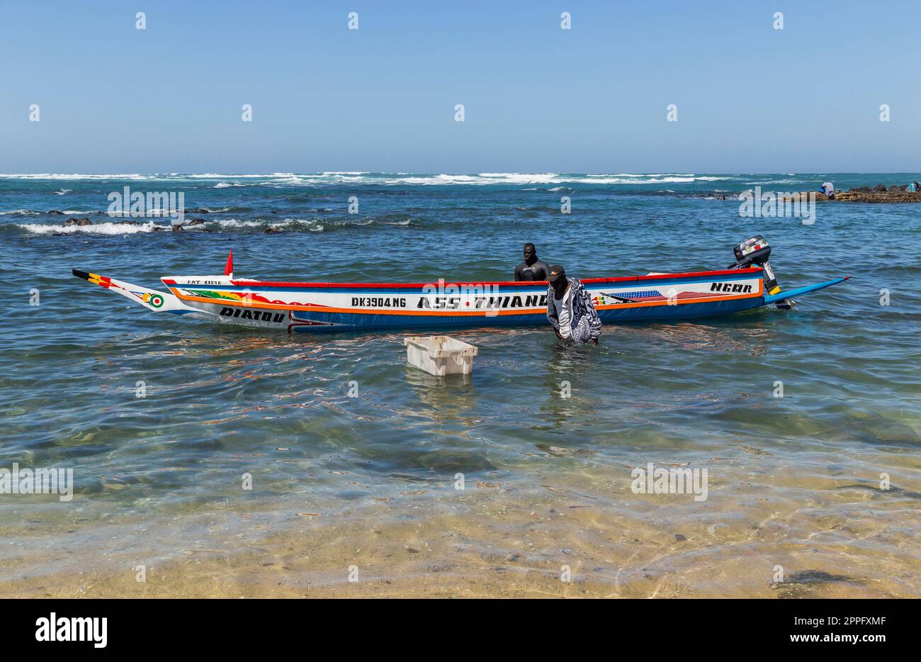 Fishermen with a fishing boat Stock Photo