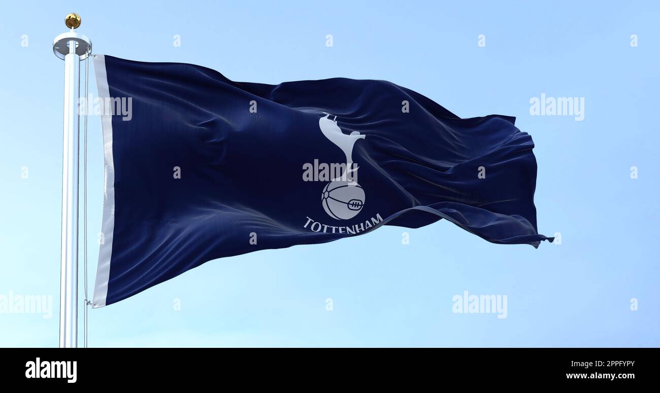 London, UK, May 2022: The flag of Tottenham Hotspur Club waving in the wind on a clear day. Tottenham Hotspur is a professional football club based in Tottenham, London Stock Photo