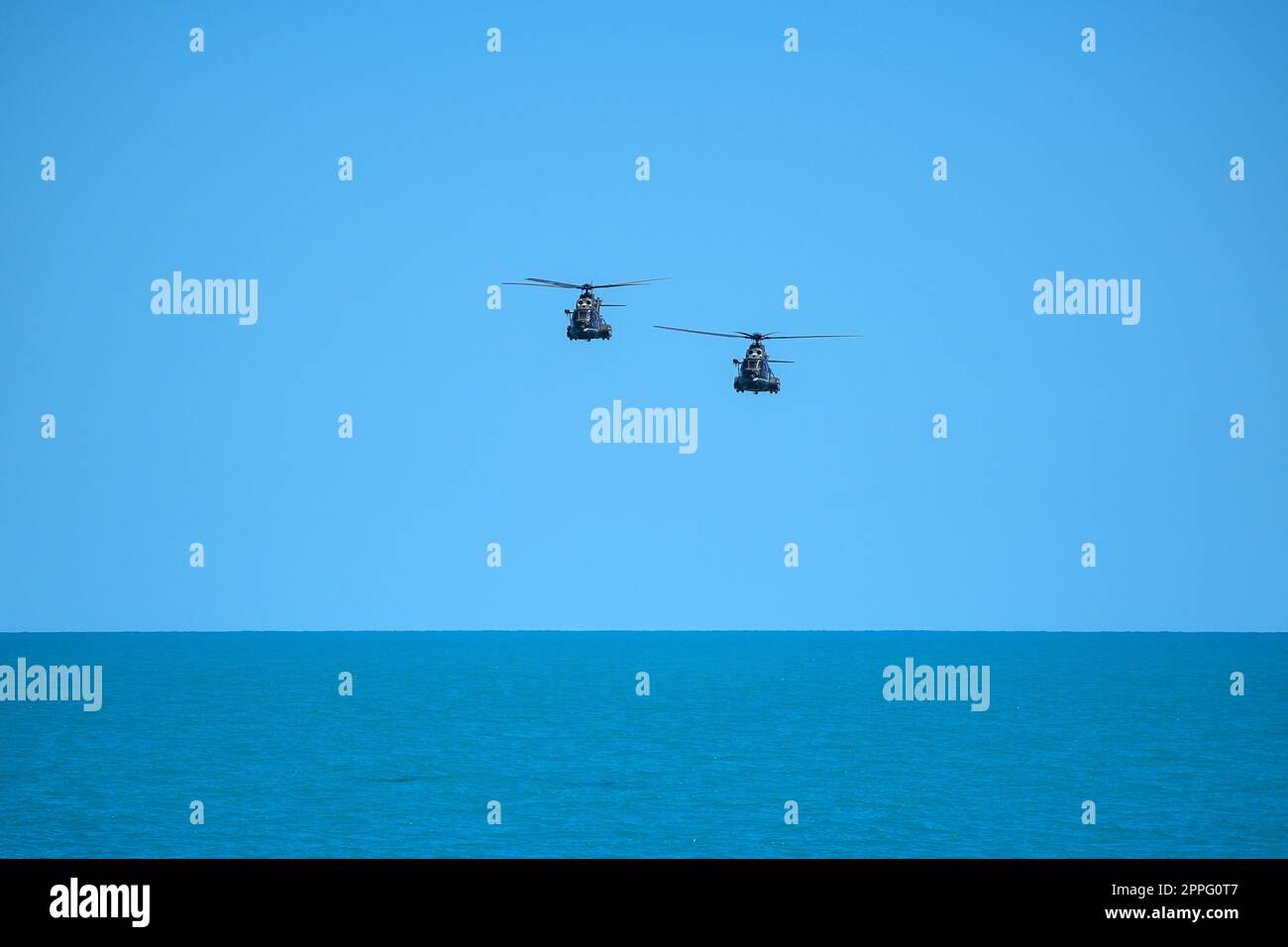 Flying military helicopters Stock Photo - Alamy