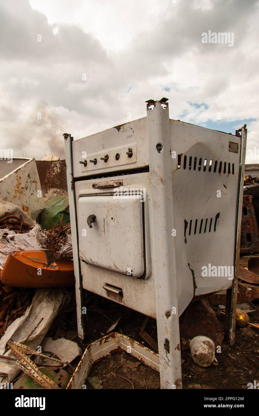 rusty old gas stove on scrap metal in the open air Stock Photo Alamy