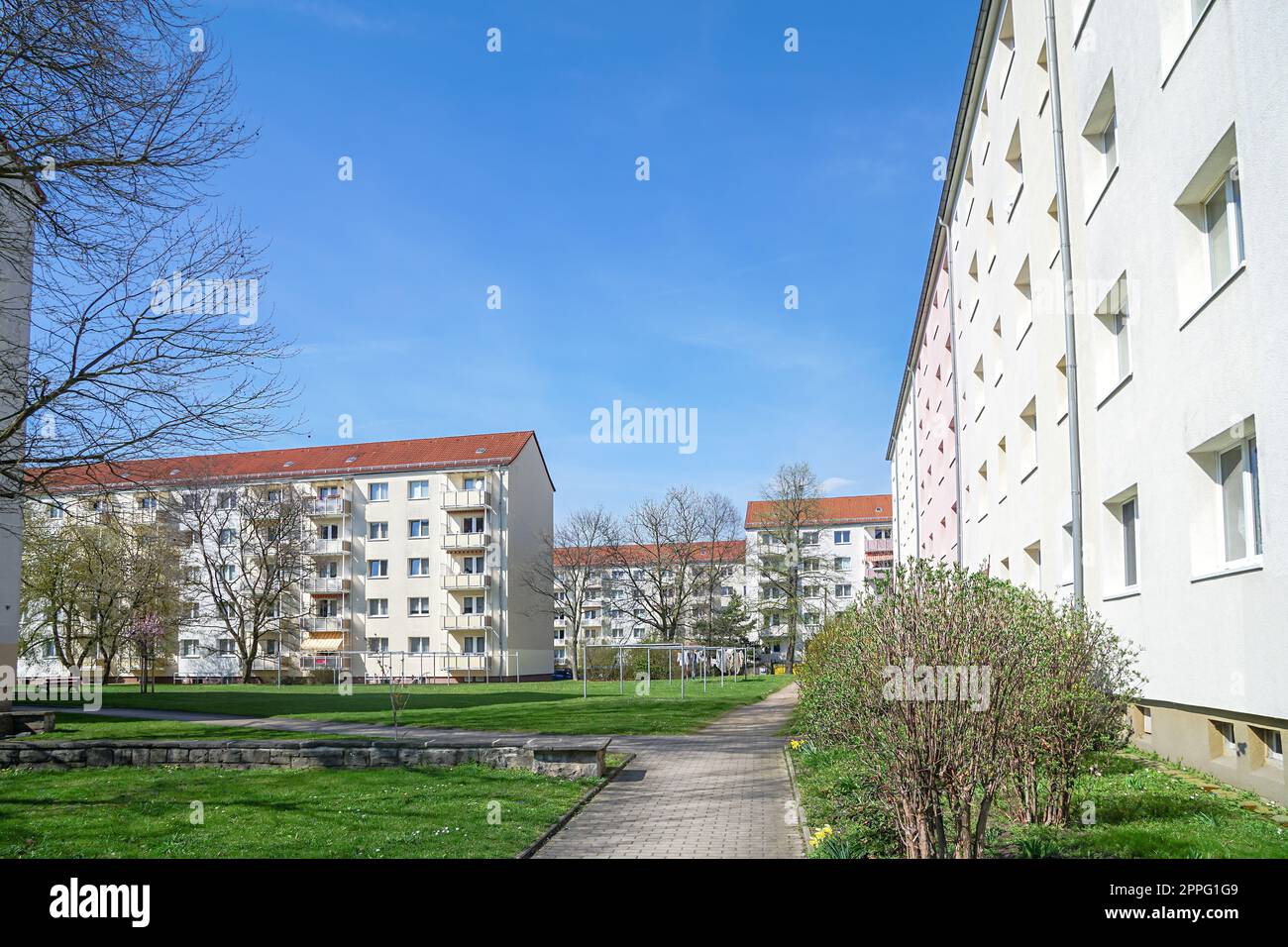 Modern urban architecture, newly renovated apartment building, apartment building in a quiet residential area with green areas Stock Photo