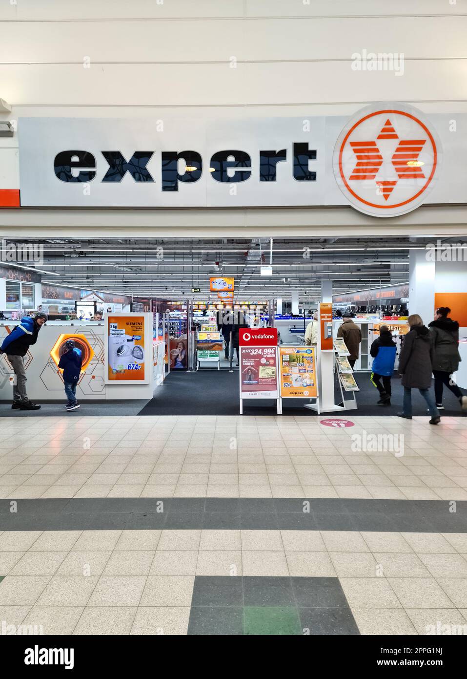 Kiel, Germany - 03 April 2023: Entrance of an Expert brand electronics store. Stock Photo