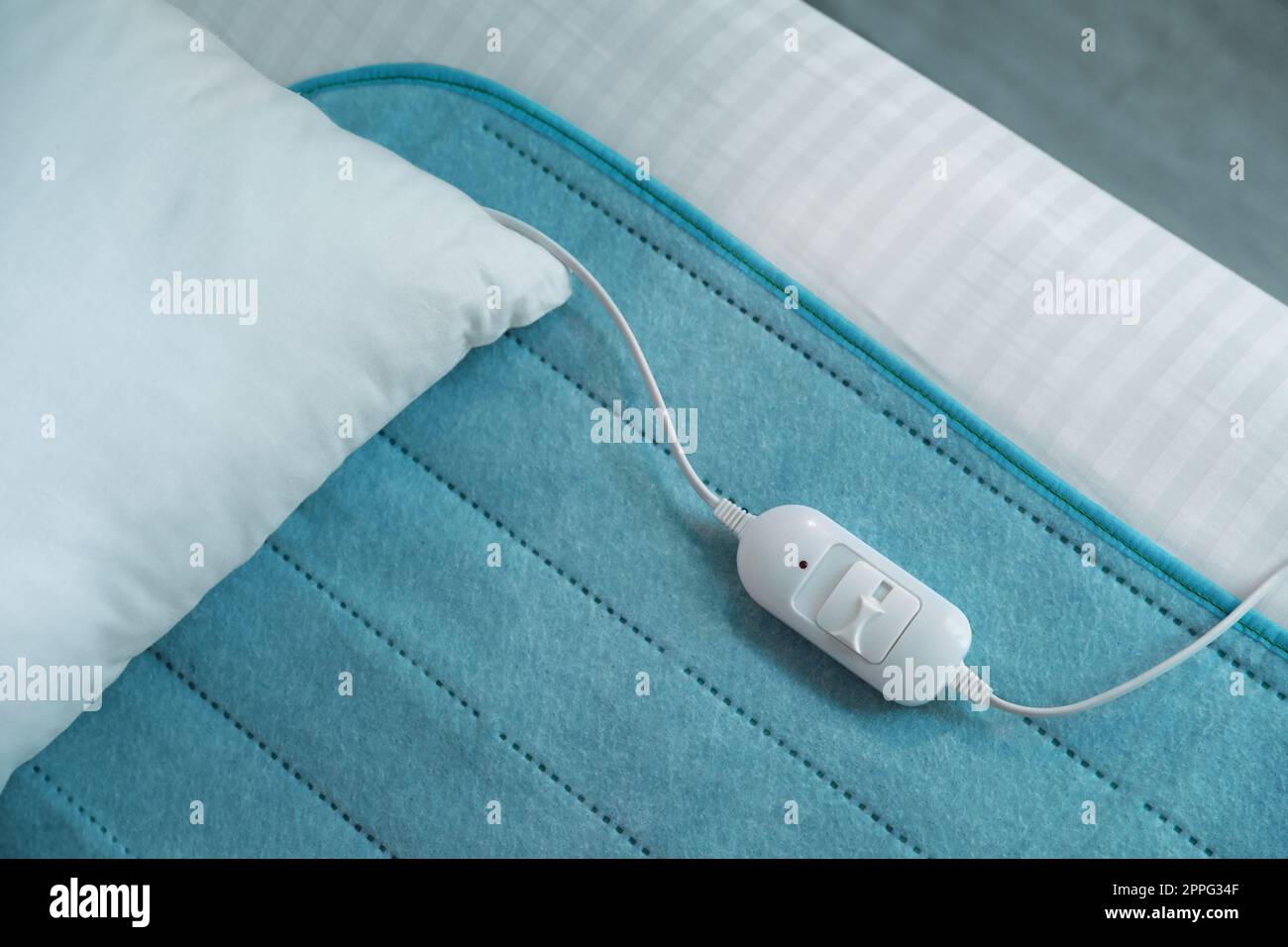 Bed with electric heating pad, top view Stock Photo Alamy