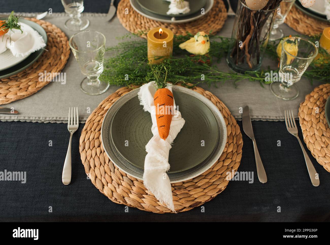 easter table decorations ready for a family meal at home. Stock Photo