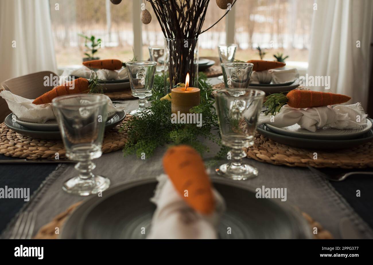 easter table decorations ready for a family dinner Stock Photo