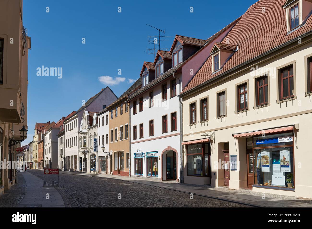 Street with some stores in the old town of Lutherstadt Wittenberg in Saxony-Anhalt in Germany Stock Photo