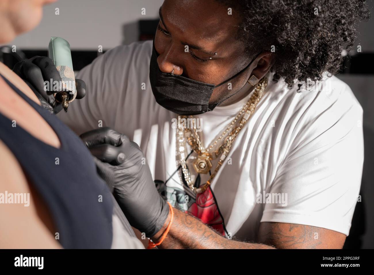 Body art at the tattoo studio Stock Photo