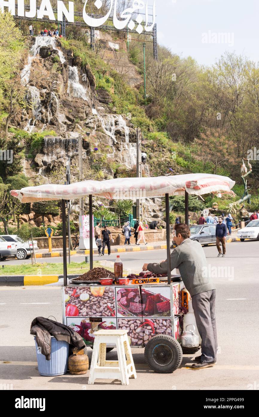 Cart-driver selling beetroot and vicia faba in fornt of Shaytan hill Stock Photo