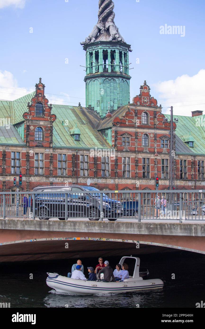 View of Borsbroen bridge and historical building of Borsen with a characteristic spiral spire, Copenhagen, Denmark Stock Photo
