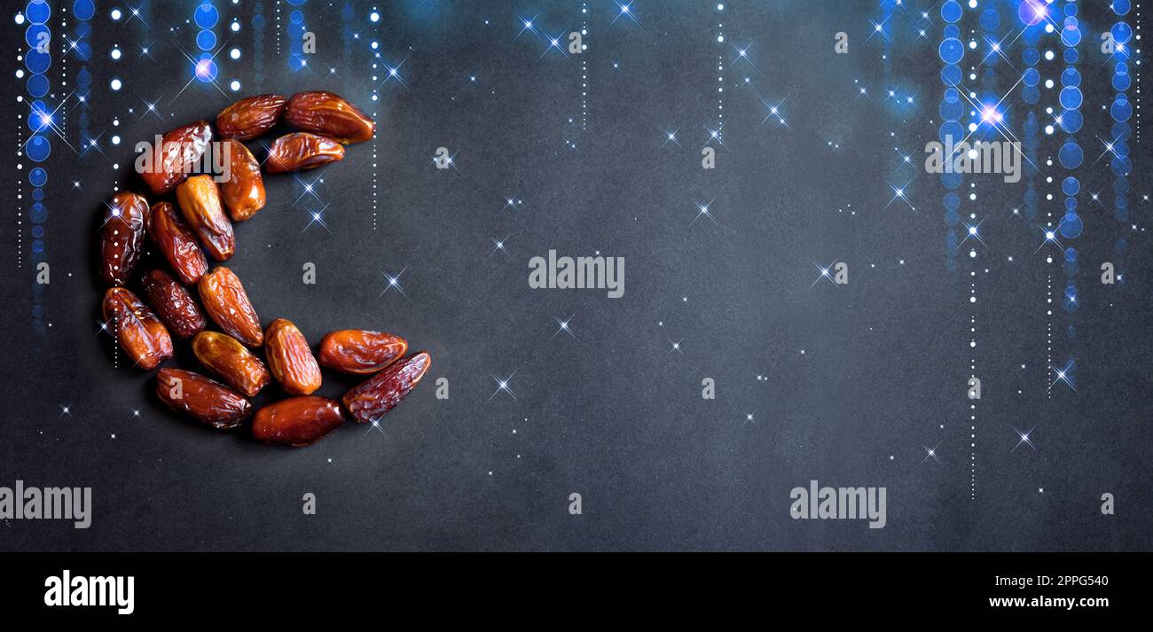 Ramadan Kareem with dates fruits arranged in shape of crescent moon on ...