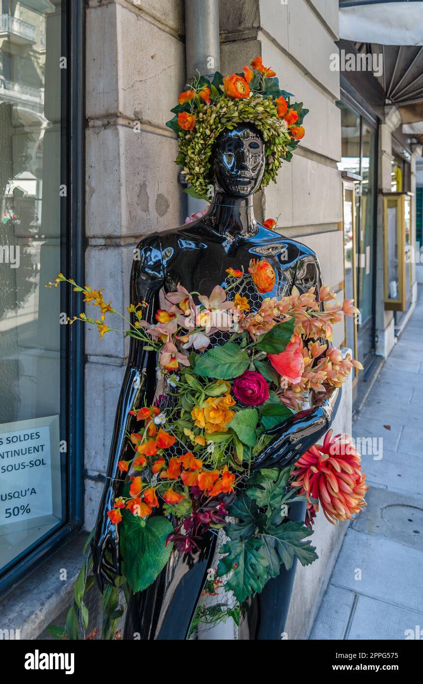 GENEVA, SWITZERLAND - SEPTEMBER 4, 2013: Mannequin decorated with floral motifs in front of a clothing store in Geneva, Switzerland Stock Photo