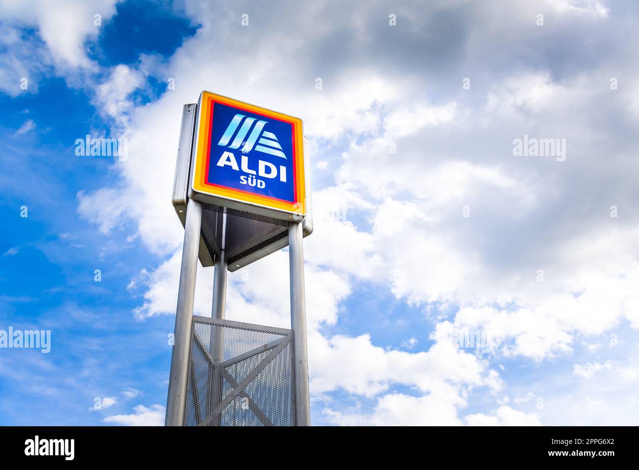Commercial sign of ALDI Store against a blue sky. ALDI is a large