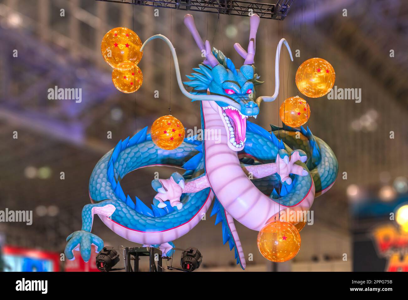 chiba, japan - december 22 2018: Huge inflatable structure depicting the dragon Shenron from the anime and manga serie of Dragon Ball floating under the ceiling of the anime convention Jump Festa 19. Stock Photo