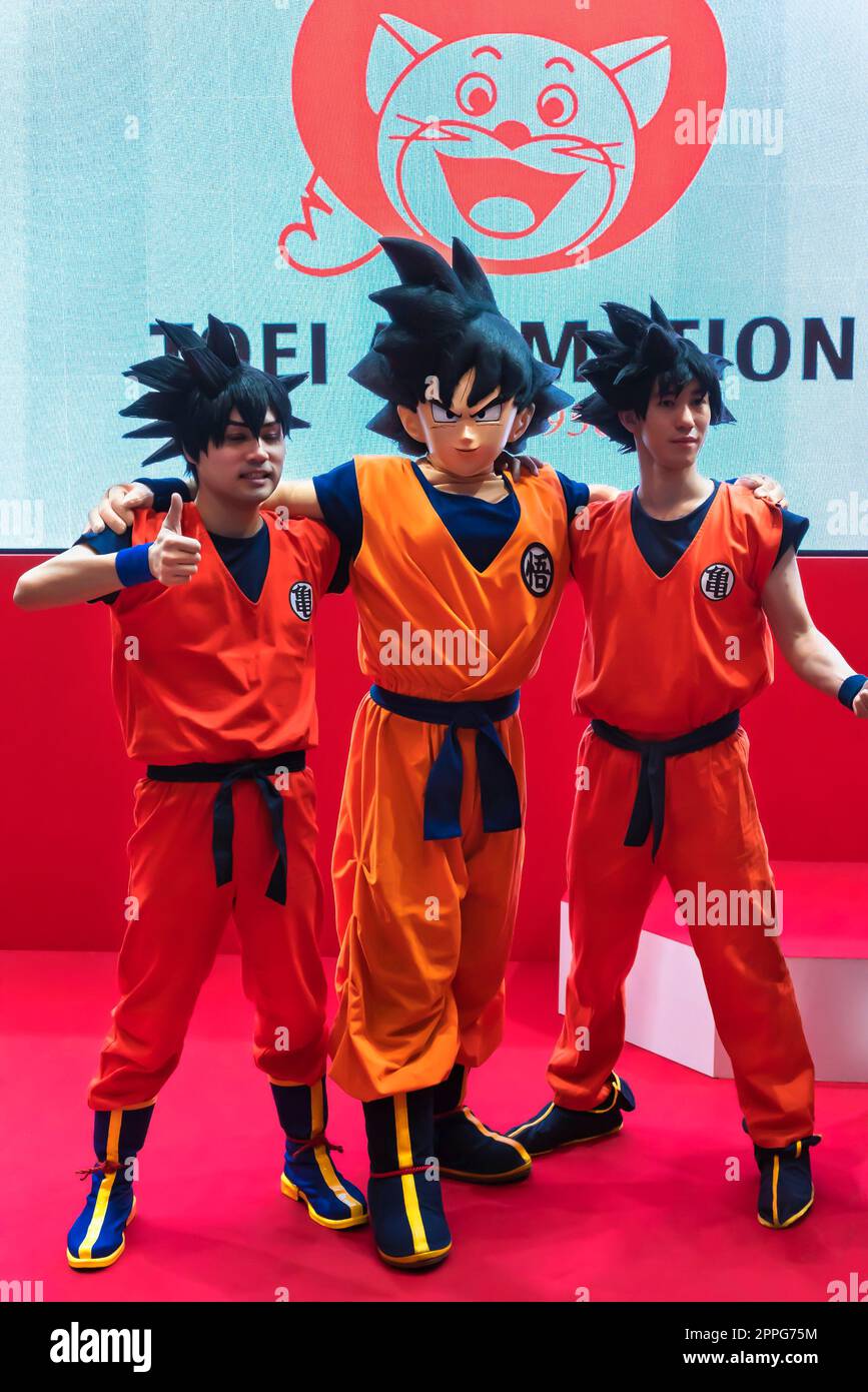 chiba, japan - december 22 2018: Three young men cosplayers wearing costume and wig of the character Son Goku of the manga and anime series of Dragon Ball during the convention Jump Festa 19. Stock Photo