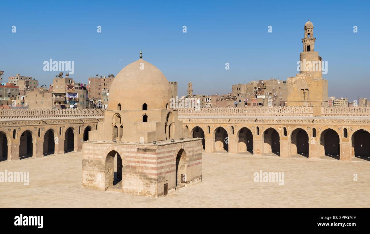 Courtyard of Ibn Tulun public historical mosque with ablution fountain and the minaret, Cairo, Egypt Stock Photo