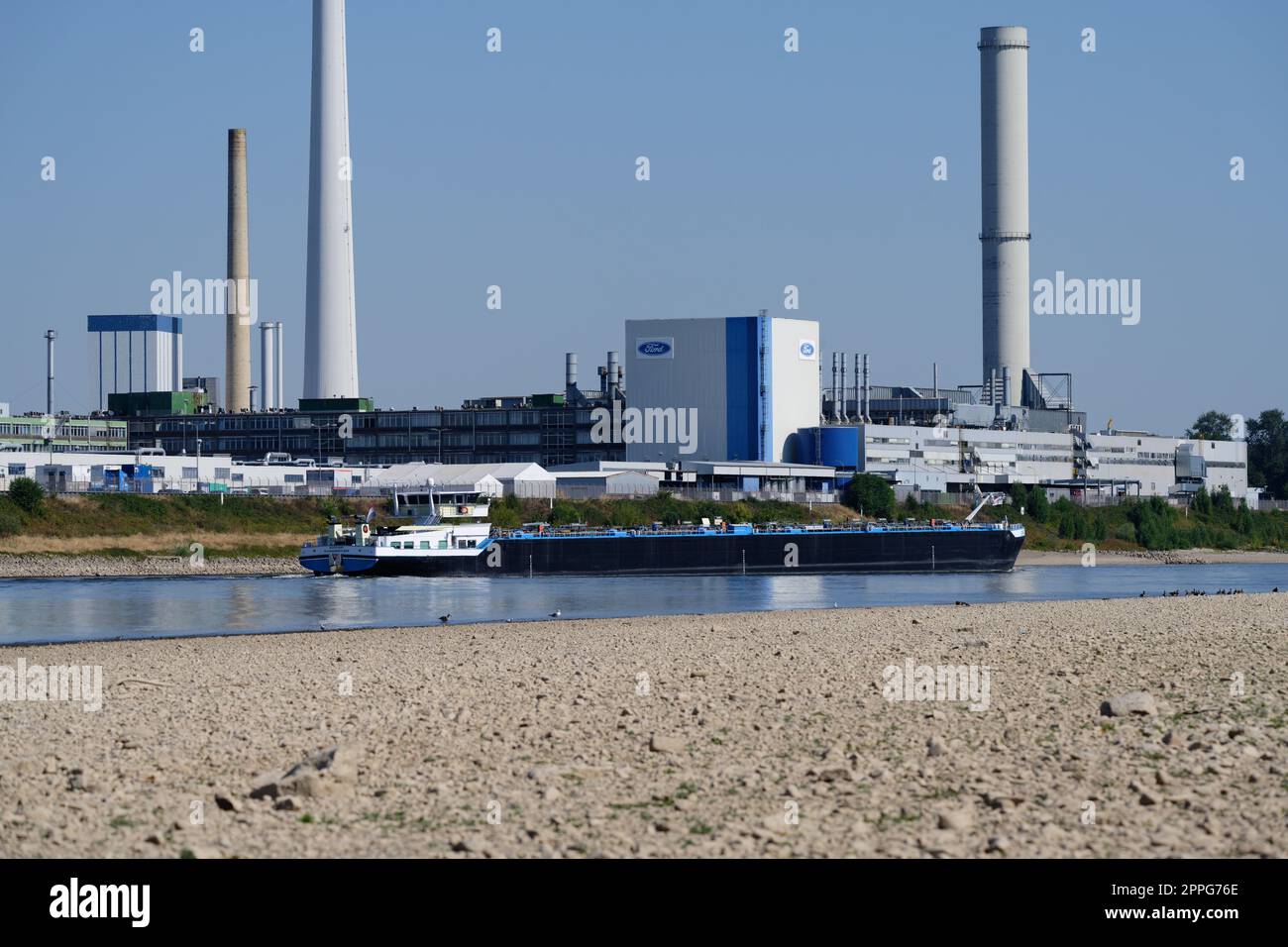 Cologne, Germany August 11, 2022: The Ford Motor Company in cologne at low water levels on the rhine Stock Photo