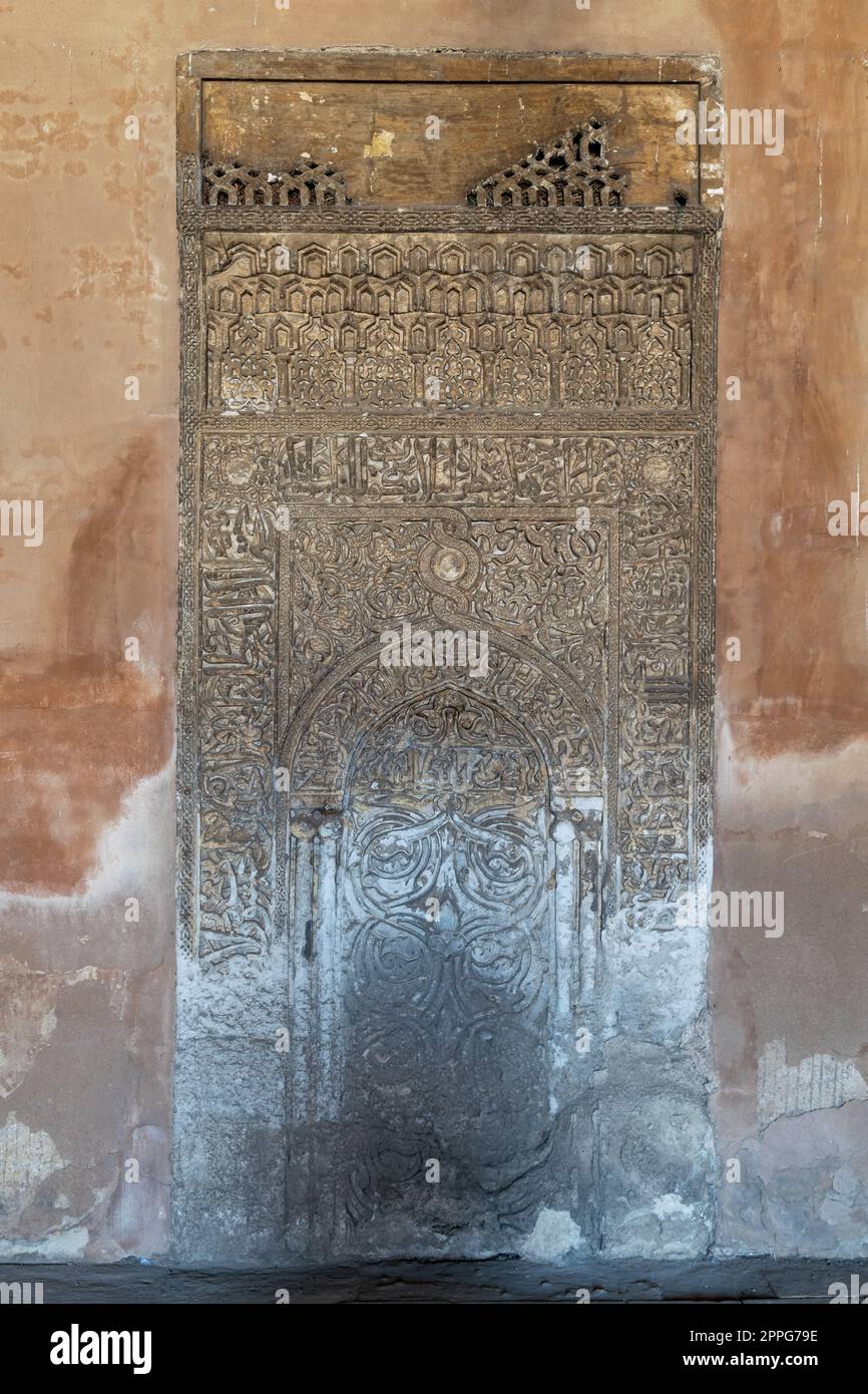 Ornate engraved stone wall with floral patterns and calligraphy, Ibn Tulun Mosque, Cairo, Egypt Stock Photo
