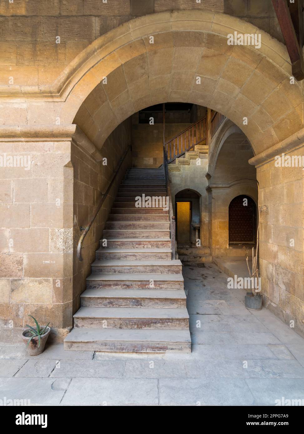 Staircase with wooden balustrade leading to an old abandoned historic building, Cairo, Egypt Stock Photo