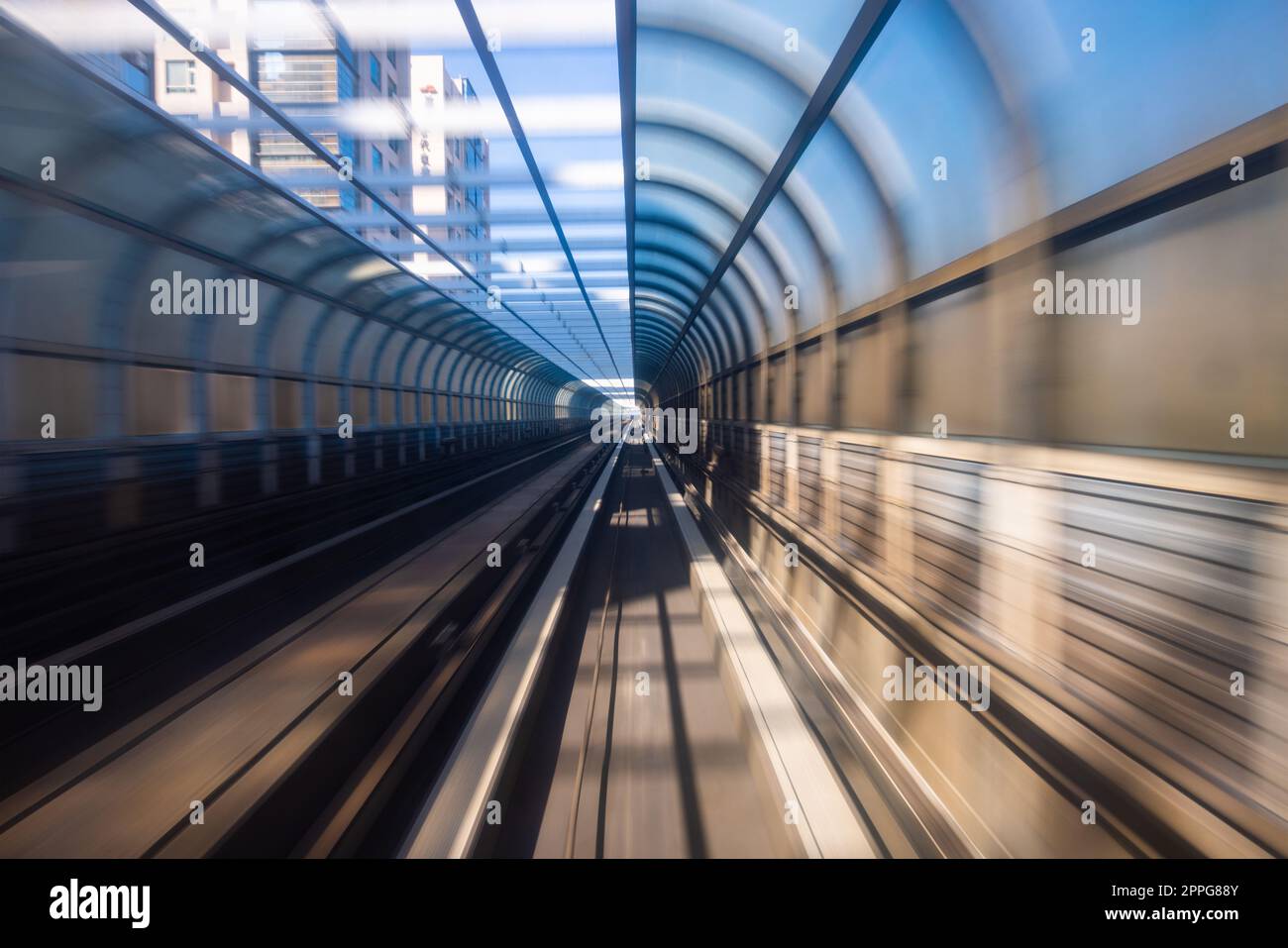 Motion blur of train moving inside tunnel Stock Photo