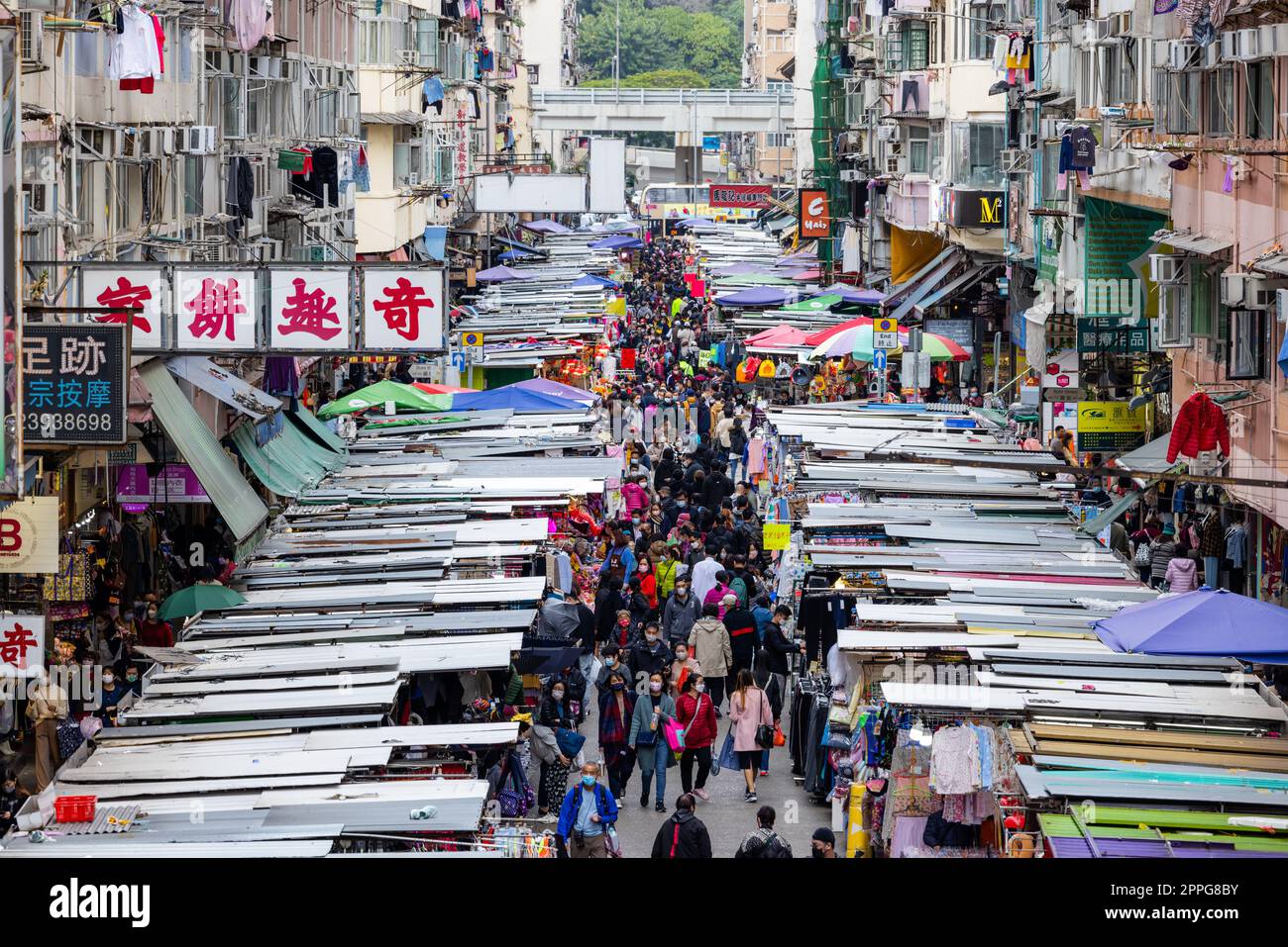Hong Kong, 24 March 2022 :Crowded people walk through the market in Fa yuen street of Mongkok city Stock Photo