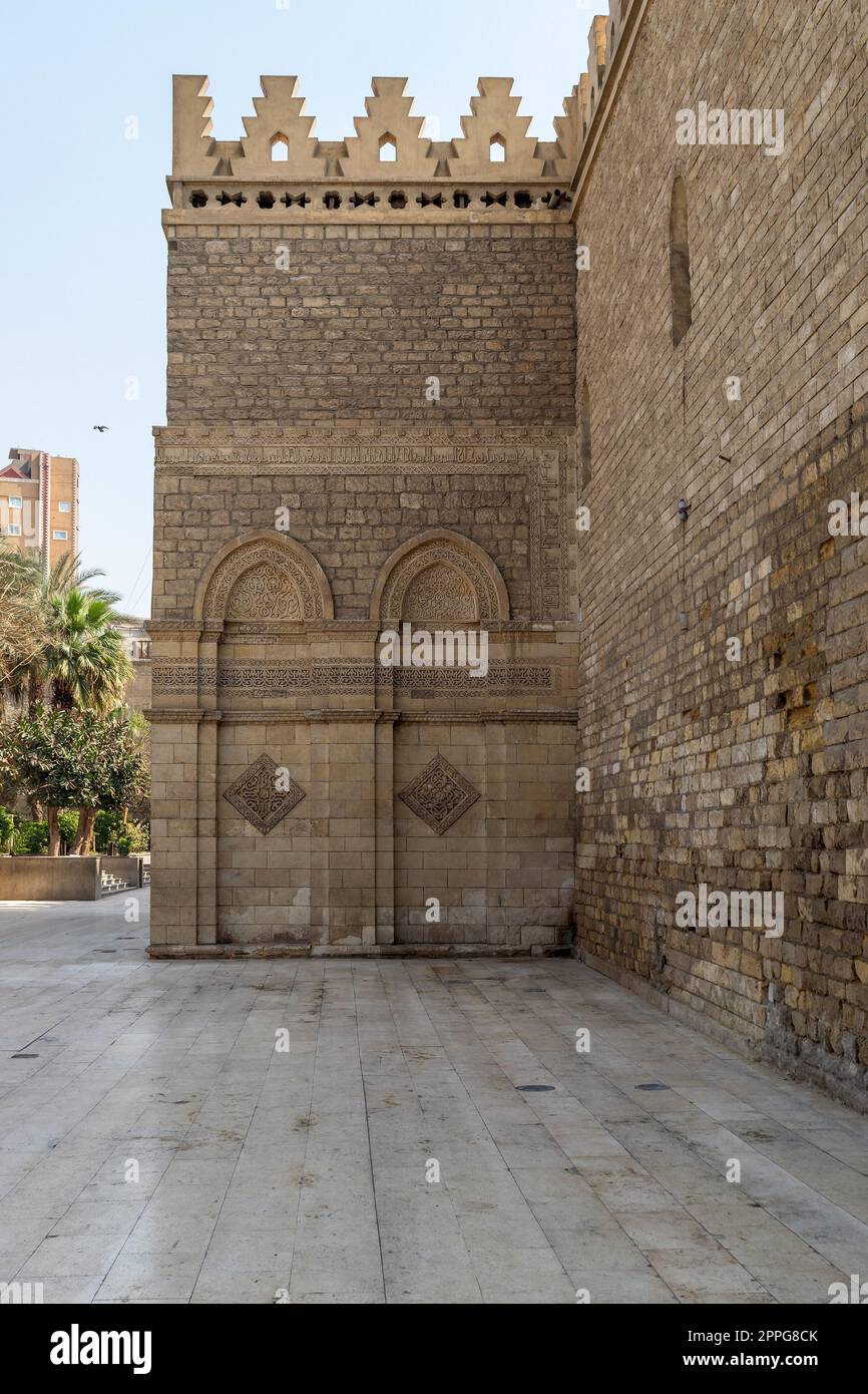 Outer wall of public historic Al Hakim Mosque - Enlightened Mosque - Moez Street, Cairo Stock Photo